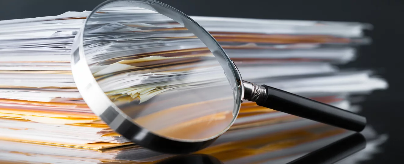 Magnifying glass over paper