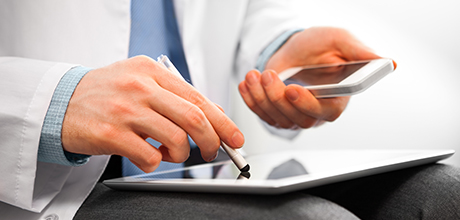 Doctor using electronics