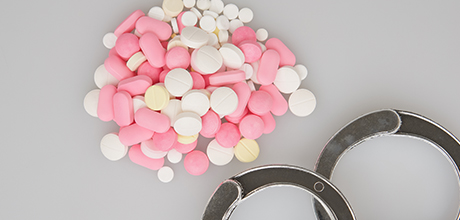 Pills and handcuffs