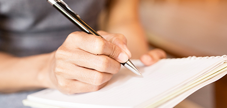 Writing in notebook