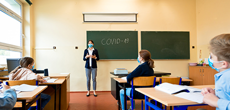 social distanced teacher in classroom