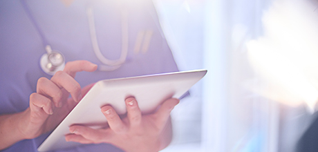 doctor with tablet