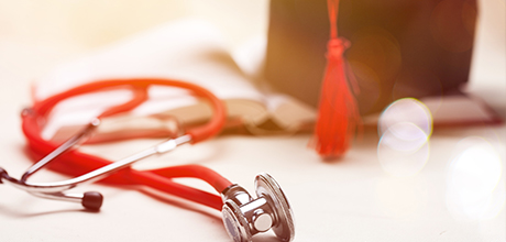 grad cap and stethoscope