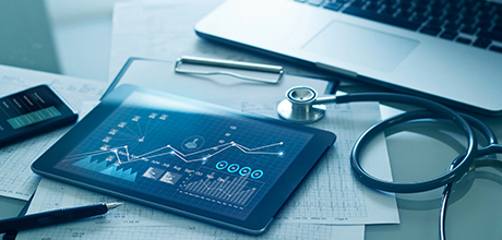stethoscope and tablet on papers