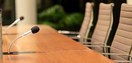 board meeting chairs and microphones