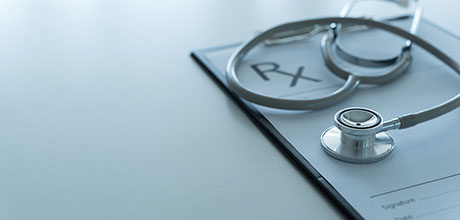 stethoscope and rx pad