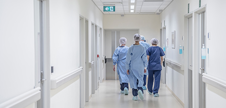 hospital employees in hospital hallway