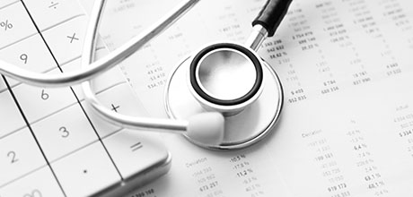 stethoscope and calculator and tax documents