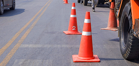 orange safety cones in the street