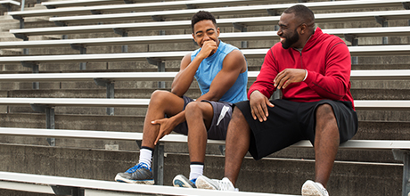 two athletes in the stadium stands