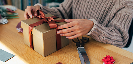 woman wrapping gift