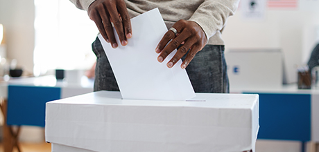 man casting ballot during election