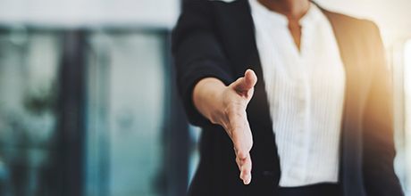 person extending hand for handshake