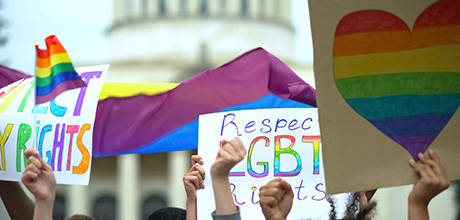 Crowd raising posters chanting to respect LGBT rights