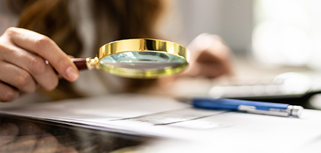 Investigation using magnifying glass