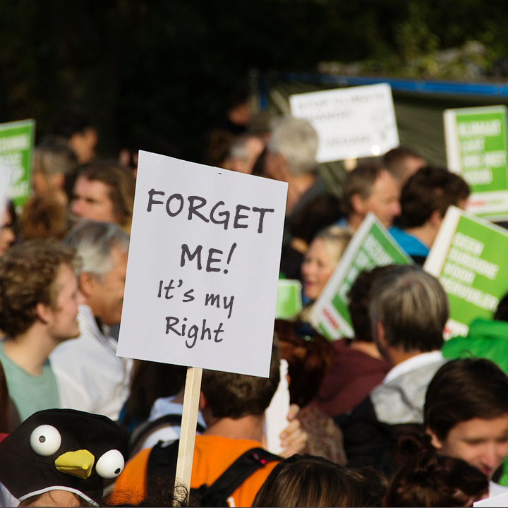 protester with sign saying forget me it