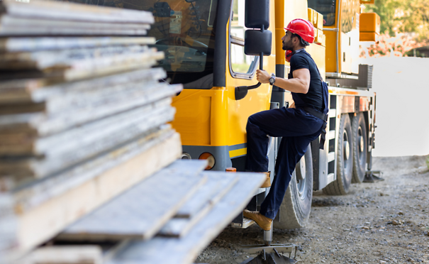 Person climbing into work truck