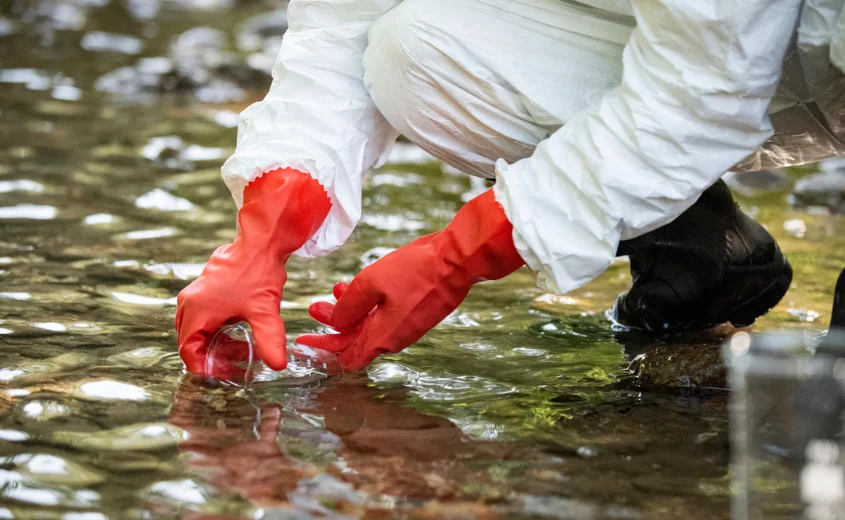 Person testing water