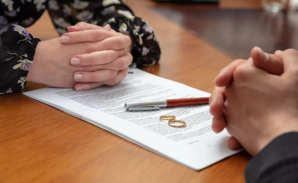 Two people looking over divorce papers