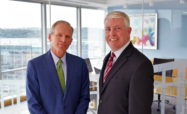 Franklin Jelsma & Chris McCloskey standing and smiling