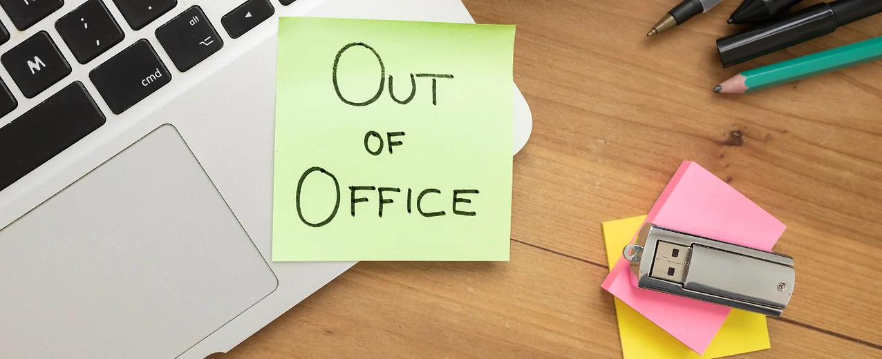 Sticky note that reads "out of office"